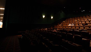 A sparse crowd waits for the show to start at a movie theater in Las Vegas. Attendance has been way down in 2020.