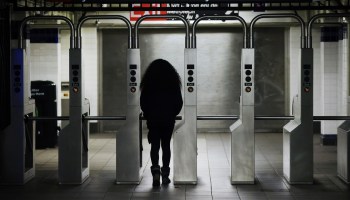 A woman exits a Brooklyn subway station on Nov. 18, 2020, in New York City