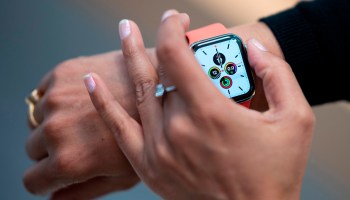 An employee demonstrate the new Apple watch inside the Apple Store at Fifth Avenue in September 2019 in New York City
