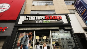 People pass a GameStop store in lower Manhattan on September 16, 2019 in New York City.