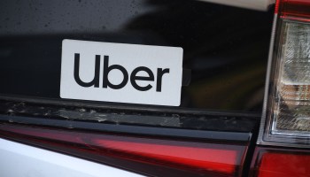 An Uber sticker on a car during a protest by ride-share drivers in 2020. How ride-share and other gig workers are classified remains controversial.