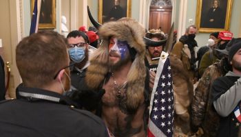 Pro-Trump extremists, including members of the QAnon conspiracy group, enter the U.S. Capitol on Jan. 6.
