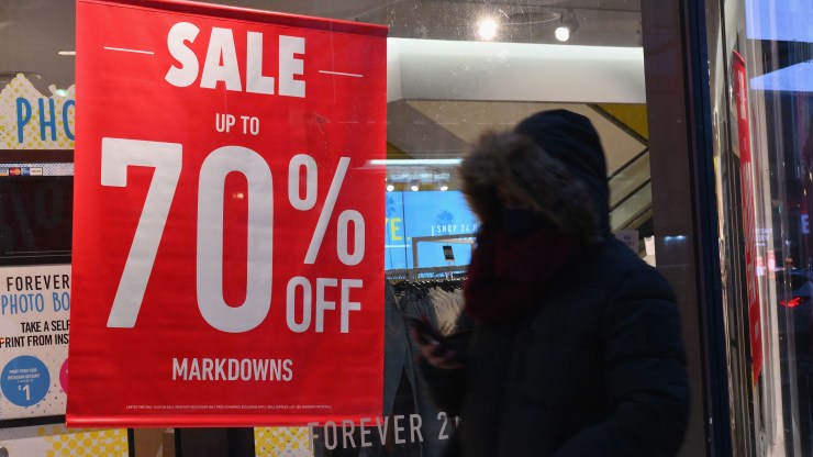 A person walks by a store displaying a sale sign on January 8, 2021 in New York City.