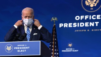 President-elect Joe Biden takes off his mask as he arrives at The Queen theater to present his plan for combating the coronavirus and jump-starting the nation’s economy January 14, 2021 in Wilmington, Delaware.