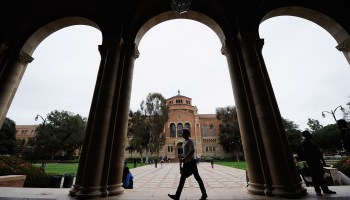 A student walks near Royce Hall at the University of California, Los Angeles.