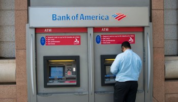 A man uses an ATM at a Bank of America branch in Washington on Oct/ 19, 2016.