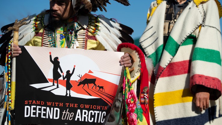 Native American leaders hold signs against drilling in the Arctic National Wildlife Refuge outside the U.S. Capitol in 2018.