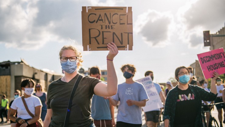 Demonstrators march in the street during the Cancel Rent and Mortgages rally on June 30, 2020, in Minneapolis, Minnesota.