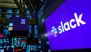 The logo for Slack is displayed on a trading post monitor at the New York Stock Exchange (NYSE), June 20, 2019 in New York City.