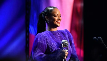 Rihanna holds her NAACP Image Award trophy.