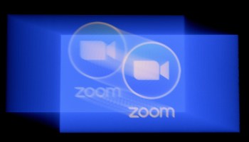 In this photo illustration, a Zoom app logo is displayed on a smartphone on March 30, 2020 in Arlington, Virginia.