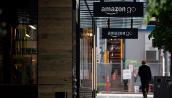 A person walks by an Amazon Go store at the downtown Amazon campus on April 30, 2020 in Seattle, Washington.