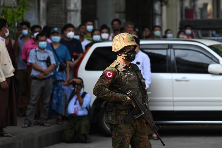 A soldier stands guard as troops arrive at a Hindu temple in Yangon, Myanmar, on February 2, 2021.