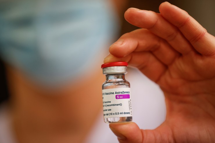 A member of the medical staff holds a vial of the AstraZeneca-Oxford COVID-19 vaccine at the South Ile-de-France Hospital Group in Melun, on the outskirts of Paris, on February 8, 2021.