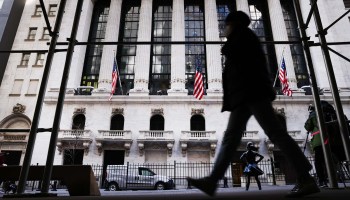 People walk by the New York Stock Exchange in the Financial District in Manhattan on January 28, 2021 in New York City.