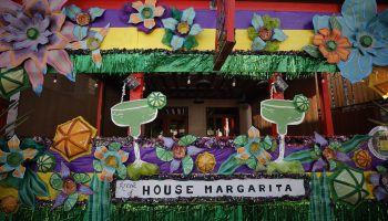 New Orleanians are decorating their homes and businesses to resemble Mardi Gras floats.