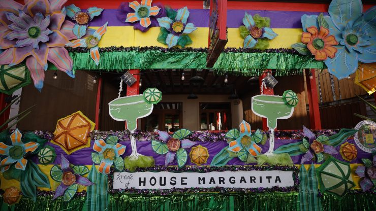 New Orleanians are decorating their homes and businesses to resemble Mardi Gras floats.