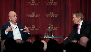 Amazon founder Jeff Bezos, left, addresses the Economic Club of New York and moderator Charlie Rose.