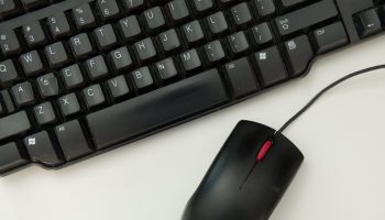 A computer mouse is seen alongside a computer keyboard in this photo illustration taken in Washington, DC, November 21, 2016.
