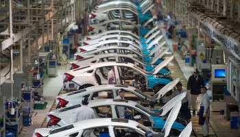 Employees work on the Honda Civic production line at the automaker's Dongfeng Honda factory in Wuhan, China in 2017.