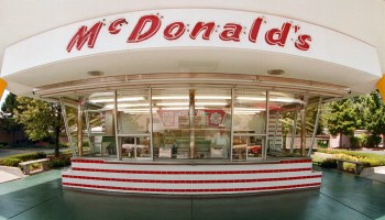 The famous golden arches and red and white tiles of McDonald's frame the two walk-up windows at the McDonald's museum July 14, 2000 in Des Plaines, IL. On this site April 15, 1955 Ray Kroc, founder of the McDonald's franchise, opened his first restaurant.