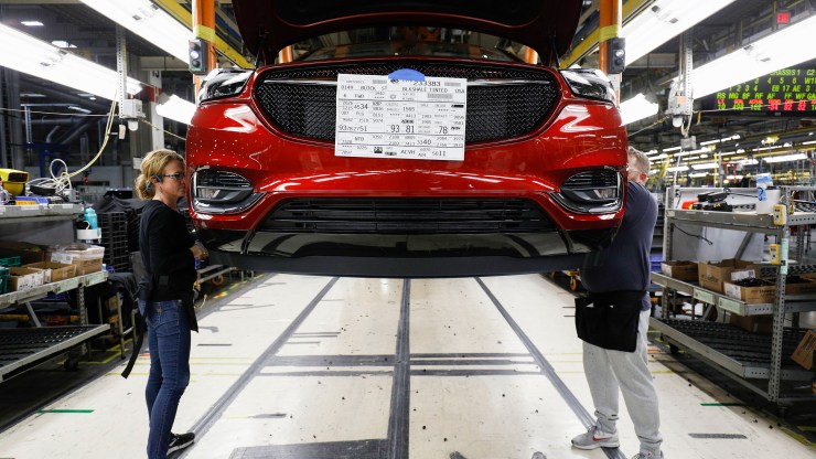 Vehicles go through the assembly line at the General Motors Lansing Delta Township Assembly Plant on Feb. 21, 2020, in Lansing, Michigan.