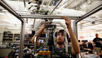 An engineering student works on a robot. Engineering is one of the fields in which the U.S. lags, according to the Bloomberg Innovation Index.