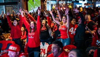 Fans react during a Super Bowl LIV watch party in a sports bar in 2020.