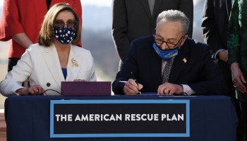 House Speaker Nancy Pelosi and Senate Majority Leader Chuck Schumer sign the American Rescue Plan Act on Wednesday. It will next move to the White House for President Biden's signature.
