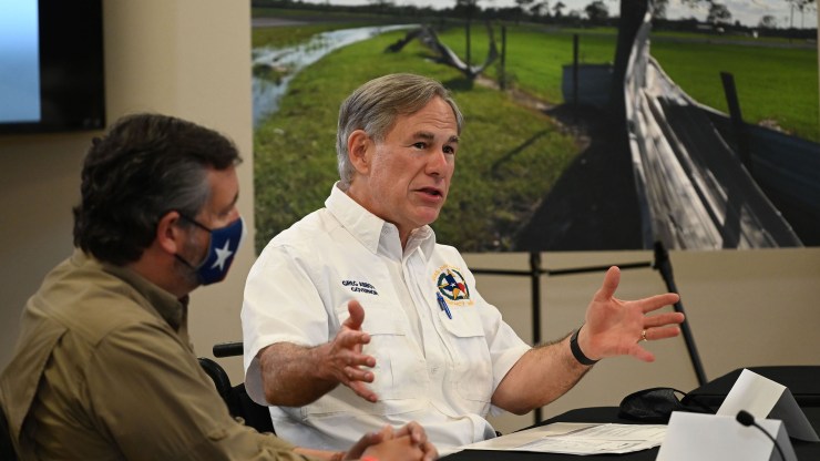 Texas Gov. Greg Abbott (right) and Sen. Ted Cruz attend a briefing for then-President Donald Trump in Orange, Texas, on August 29, 2020.