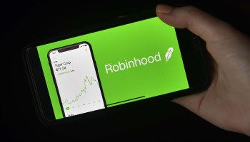 This photo illustration shows the logo of trading application Robinhood on a mobile phone in Arlington, Virginia on January 28, 2021.