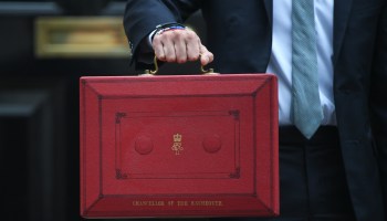 The U.K.'s Chancellor of the Exchequer Rishi Sunak holds up the red box containing the latest budget proposals outside 11 Downing Street in London.