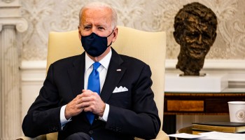 President Biden holds a meeting in the Oval Office.