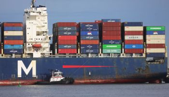 A ship stacked with containers for international trade.