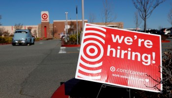 A hiring sign is posted in front of a Target store on February 5, 2021 in San Rafael, California.
