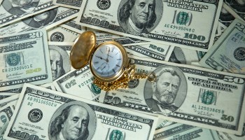 A photo illustration shows a pocket watch and US currency.