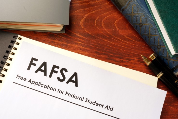 This stock illustration shows a piece of paper on a desk with the header FAFSA: Free Application for Federal Student Aid."