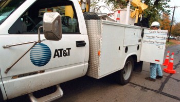An AT&T technician parks his service truck on October 26, 2000 as he prepares to troubleshoot an aerial cable in Des Plaines, Illinois.