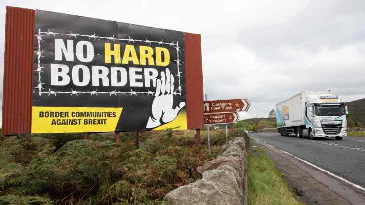 A sign in Northern Ireland reads: "No Hard Border: Border Communities Against Brexit."