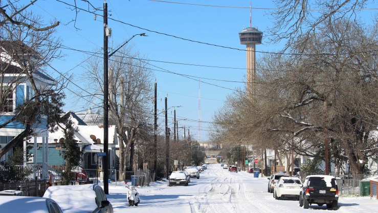 Several inches of snow blanket a residential street in Texas on Feb. 15, 2021.