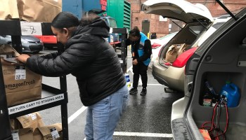 Julia Soler loads groceries into her minivan to deliver for Amazon Flex.