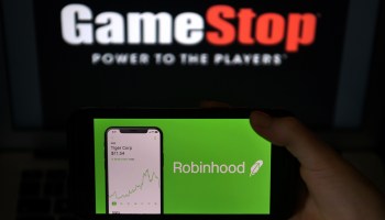 A photo illustration shows the logos of video game retailer GameStop and stock trading app Robinhood.
