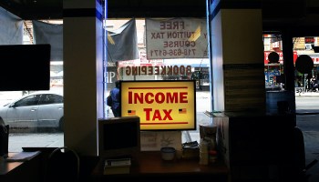 An income tax sign in a shop window.