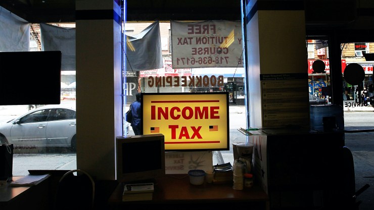 An income tax sign in a shop window.