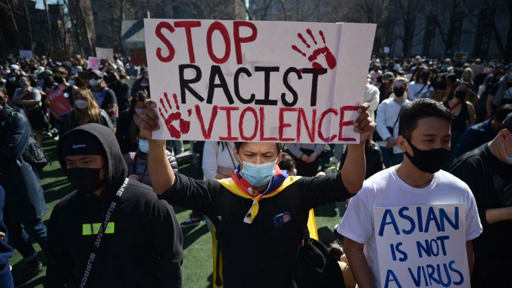 Members and supporters of the Asian American community attend a "rally against hate" at Columbus Park in New York City on March 21, 2021.