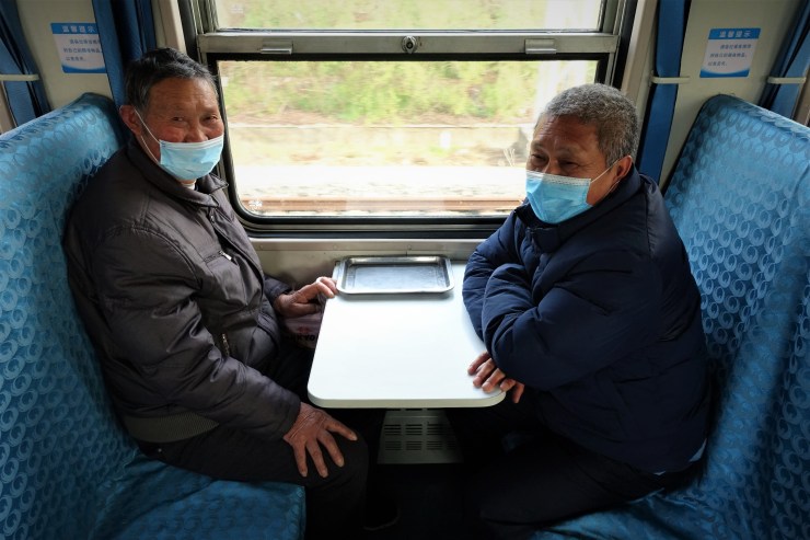 Retirees Zhou Shichen (left) and Tan Zhaoyin (right) are regular commuters of Train 8324. (Charles Zhang/Marketplace)