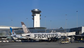 A Frontier airlines plane is seen at the Las Vegas International Airport gate on August 30, 2020 in Las Vegas, Nevada.
