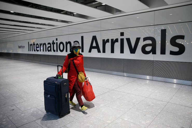 Travelers arrive at Heathrow Airport on January 17, 2021 in London, England.