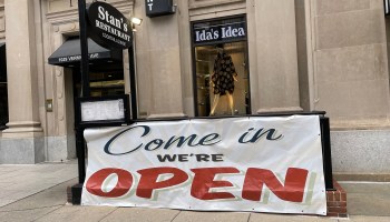 An open banner is seen outside a restaurant on January 25, 2021 in Washington, DC, as restaurants in the area open again inside at 25% capacity during the COVID-19 pandemic.