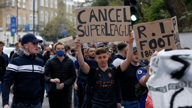 Soccer supporters demonstrate against the proposed European Super League outside of Stamford Bridge football stadium in London on April 20, 2021, ahead of the English Premier League match between Chelsea and Brighton and Hove Albion.